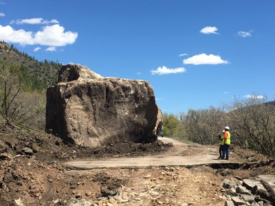 CDOT geo-technical personnel believe a large outcropping from the ridgeline above the highway broke into two large pieces as it rolled down the slope to CO 145.