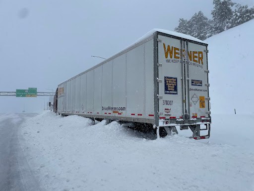 Semi truck stuck on the side of the road on I-70 during the storm