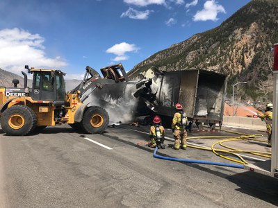 CDOT crews and firefighters hosing down semi-truck accident on I-70