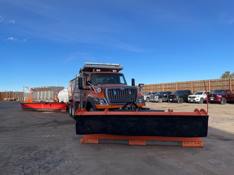 A CDOT tow plow pulls a trailer with a second tow blade, allowing for faster and more efficient snow removal.